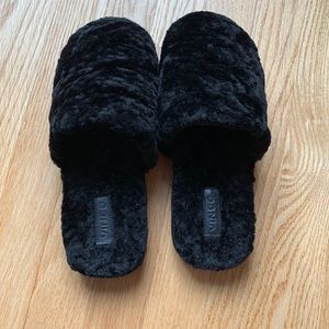 Black fuzzy slippers
